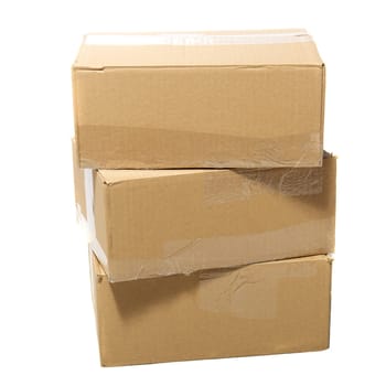 Three closed cardboard boxes packed with goods ready for shipping