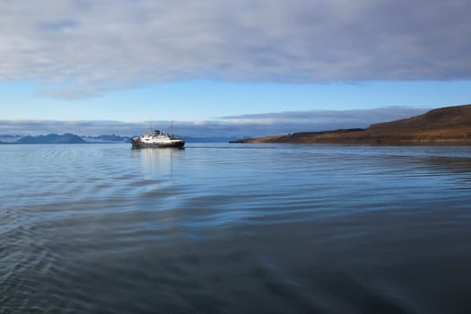 Hurtigruten post steamer at Grønfjorden, Svalbard coast