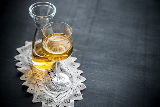 Glass of white wine in vintage decor