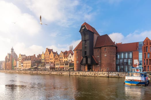 Zuraw Port Crane and the Motlawa embankment in Gdansk, sunny weather.