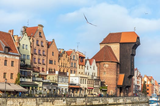 Promenade in Gdansk by the Motlawa river, view on Zuraw Port Crane.