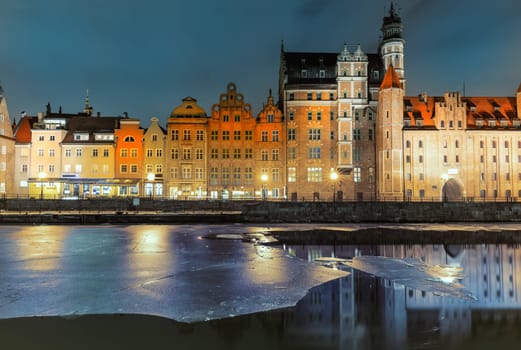 Mariacka Gate and other sights of Gdansk on the bank of the Motlawa, evening view.