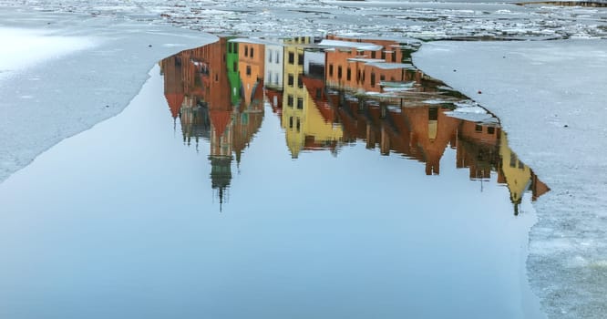 Old Poland buildings, reflection in the river Motlawa in Gdansk