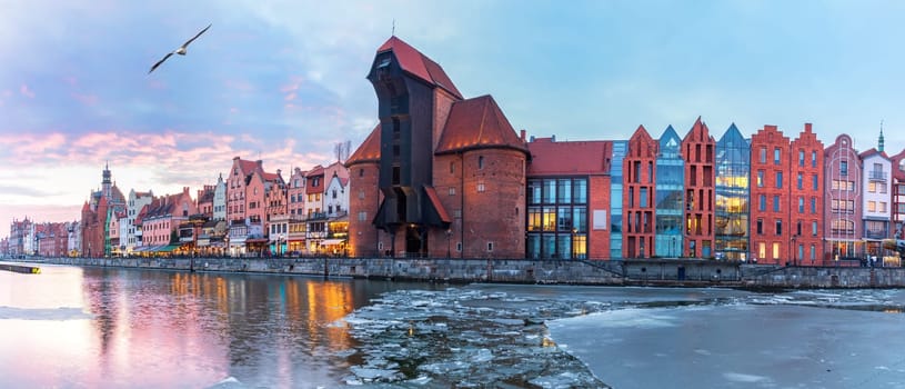 Gdansk panorama at sunset, view on Zuraw port crane from the Motlawa river.
