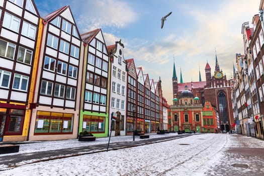 European street of Gdansk with colorful facades, Four Quarters Fountain, Royal Chapel and the Basilica of the Assumption of the Blessed Virgin Mary.