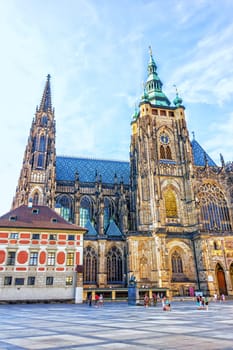 Gothic St. Vitus Cathedral in Prague Castle and a square in front.
