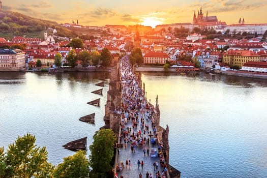 Charles Bridge at sunset, view from Old Town Bridge Tower in Prague.