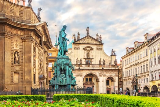 Basilica of Saint Francis of Assisi and a monument to Carlos IV in a square in Old Town of Prague.