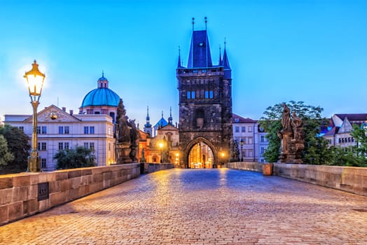 Charles bridge and Old Town of Prague in morning twilight.