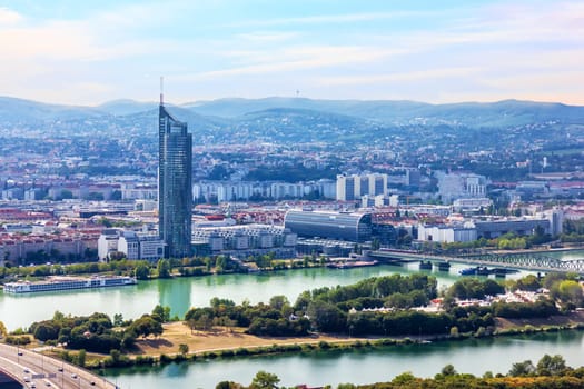 Towers in the modern district of Vienna and the bridges over the Danube.