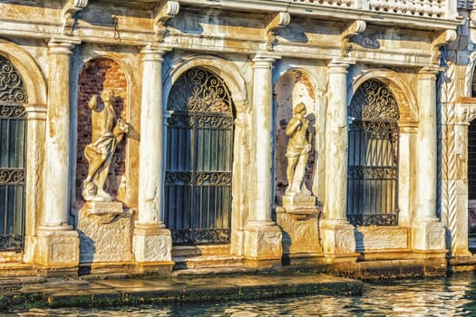 Statues on the facade of Giusti Palace on the Grand Canal of Venice, Italy.