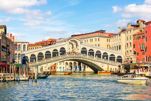 Rialto Bridge, a popular landmark of Venice in Italy, summer view.