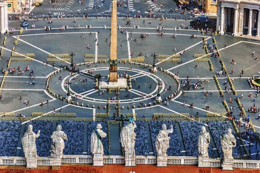 St Peter's Square and the Statues of the Apostoles on the Dome of the Papal Basilica of St Peter in Vatican.