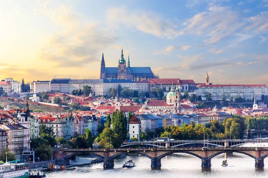 Prague city view with Manes bridge and Lesser Town with Prague castle on the background.