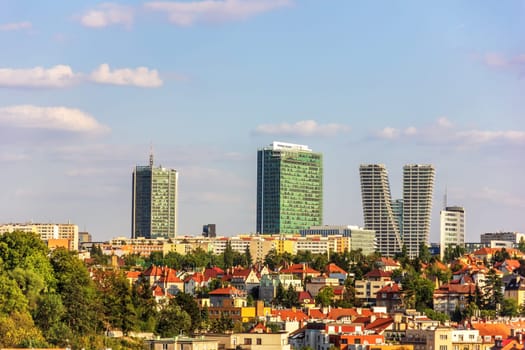 Prague skyline with skyscrapers and oild buildings.