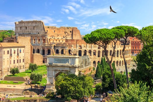 Roman Coliseum and the Arch of Titus summer view, no people.