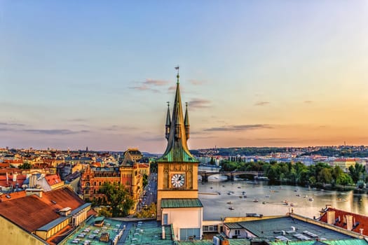 Prague Old Town Water Tower on Charles Bridge and the Vltava river.