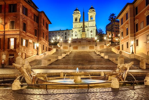 Spanish Steps and Fontana della Barcaccia night view, no people, Rome, Italy.