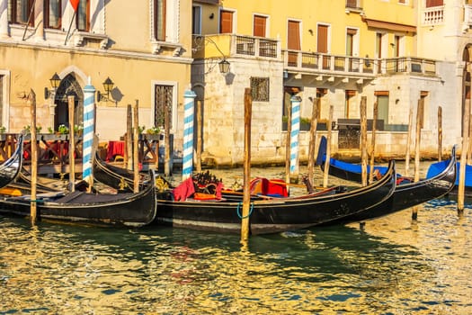Gondolas moored on the Grand Canal of Venice, Italy.