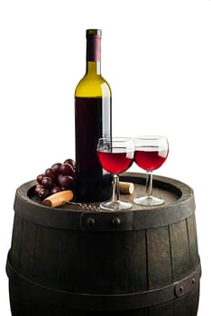 Glass and bottle of red wine on wooden barrel background isolated on white