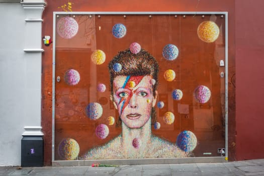 London, England - December 2018 : Graffiti in memory of singer David Bowie as Ziggy Stardust, Brixton