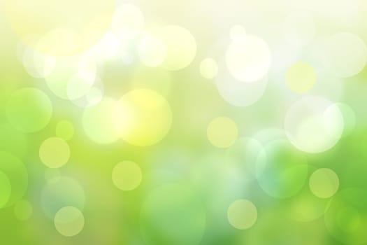 Abstract bright spring or summer landscape texture with natural green bokeh lights and yellow circular lights. Autumn or summer background with copy space.