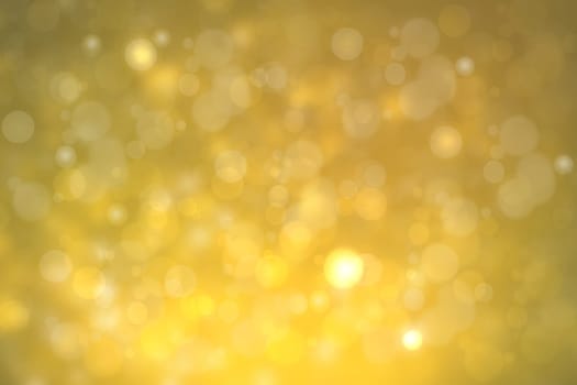 A festive abstract golden yellow gradient background texture with glitter defocused sparkle bokeh circles. Card concept for Happy New Year, party invitation, valentine or other holidays.