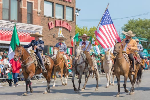 Chicago, Illinois , USA - September 10, 2017, The 26th Street Mexican Independence Parade celebrates Mexican Independence from Spain with floats, mariachi bands and dancing in the streets.