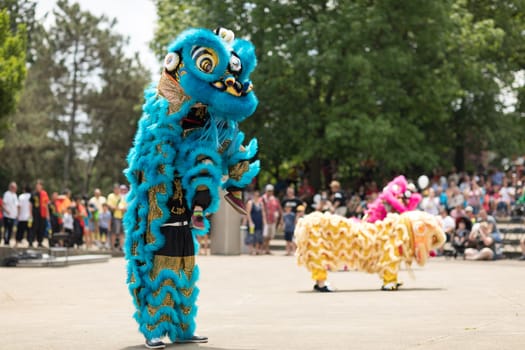 Columbus, Ohio, USA - May 27, 2018  Members of the Tay Phuong Monastery perform a lion dance at the Asian Festival.
