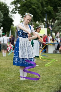 Frankenmuth, Michigan, USA - June 10, 2018 Members from the Frankenmuth dance center perform the maypole dance during the Bavarian Festival.