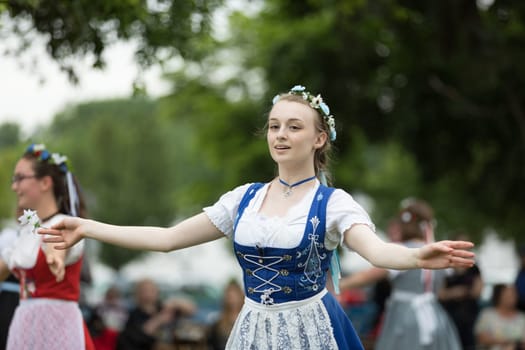 Frankenmuth, Michigan, USA - June 10, 2018 Members from the Frankenmuth dance center perform the maypole dance during the Bavarian Festival.