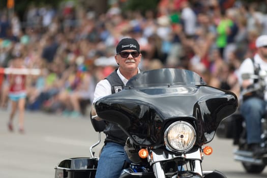 Indianapolis, Indiana, USA - May 26, 2018, A groups of Bikers going down the street at the Indy 500 Parade