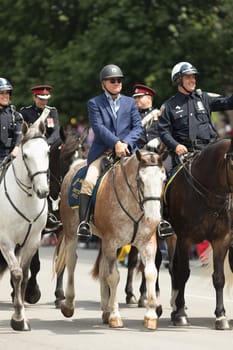 Indianapolis, Indiana, USA - May 26, 2018, Police officers on horses going down the street at the Indy 500 Parade