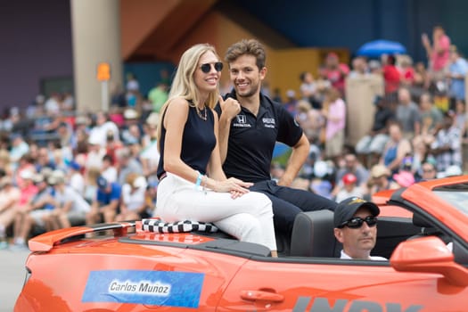 Indianapolis, Indiana, USA - May 26, 2018, Indycar drivers  Carlos Muñoz going down the road at the Indy 500 Parade