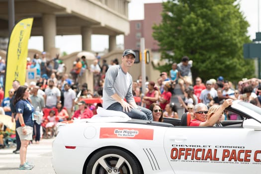 Indianapolis, Indiana, USA - May 26, 2018, Ben Higgins from the tv series The Bachelor, on a car going down the street at the Indy 500 Parade