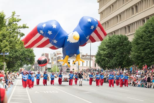 Indianapolis, Indiana, USA - May 26, 2018,  Balloon in shape of an eagle with the colors of the american flag goes down the road during the Indy 500 Parade