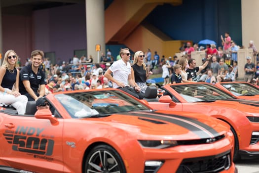 Indianapolis, Indiana, USA - May 26, 2018, Indycar drivers  Carlos Muñoz, Max Chilton and  James Davison going down the road at the Indy 500 Parade