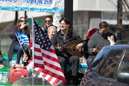 Chicago, Illinois, USA - April 29, 2018  Greek man playing the lavouto during the Greek Independence  Day Parade