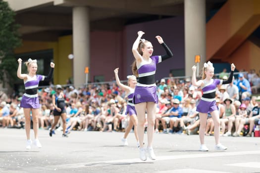 Indianapolis, Indiana, USA - May 26, 2018, Members of the Wishes Dance Studio performs down the street at the Indy 500 Parade