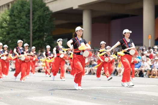Indianapolis, Indiana, USA - May 26, 2018, Members of the Indianapolis Chinese Community Center, Inc. Playings drums  at the  Indy 500 Parade