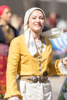 Chicago, Illinois, USA - April 29, 2018 Greek woman wearing traditional clothing during the Greek Independence  Day Parade