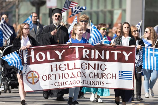 Chicago, Illinois, USA - April 29, 2018  Member of the holy Trinity Hellenic Orthodox Church at the Greek Independence  Day Parade