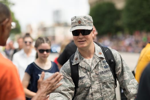 Indianapolis, Indiana, USA - May 26, 2018, A member of the US Air Force handshakes espectators at the Indy 500 Parade