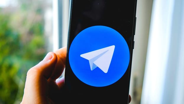 hand use Telegram app symbol on smartphone in Bologna, Italy, 08 March 2019