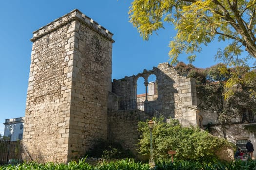 EVORA, PORTUGAL - CIRCA MARCH 2019: Fake Ruins in the Evora Public Park in Portugal built in the 1860s using materials from the ruins of several other local monuments mostly remains of twinned windows in Manueline and Mudejar styles