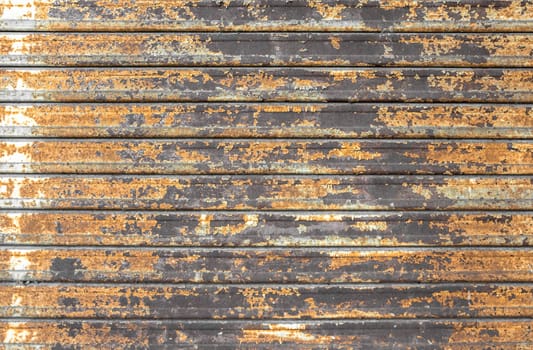 Close up of rusty shutters of a garage. Ideal for concept and backgrounds. Space for text.