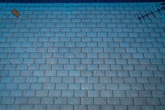 Rectangular pattern of a stony pathway on the street