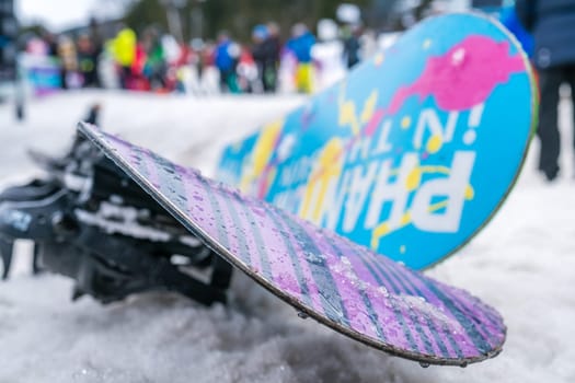 Szklarska Poreba, Poland - February 2019 : Colorful snowboards left in the snow on the mountain slope in winter