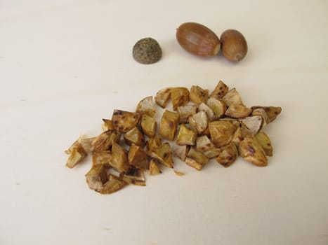Roasted acorns on wooden board