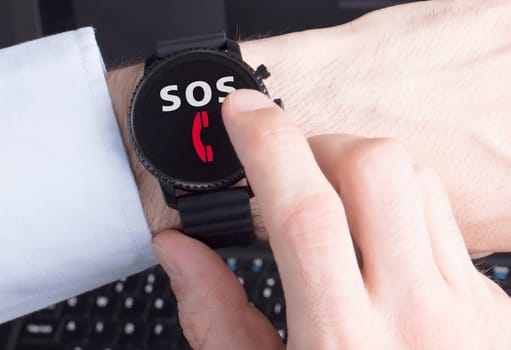 Black smartwatch isolated on a black background, SOS
